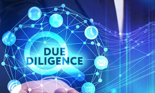 A person in a suit extends their hand, with a blue, glowing network of icons and lines overlaying their palm. The words "DUE DILIGENCE" are highlighted in the center, surrounded by icons representing various business and technological elements, showcasing our services.